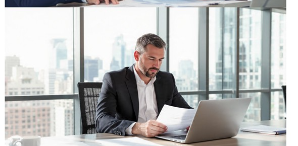 Compliance officer reviewing files